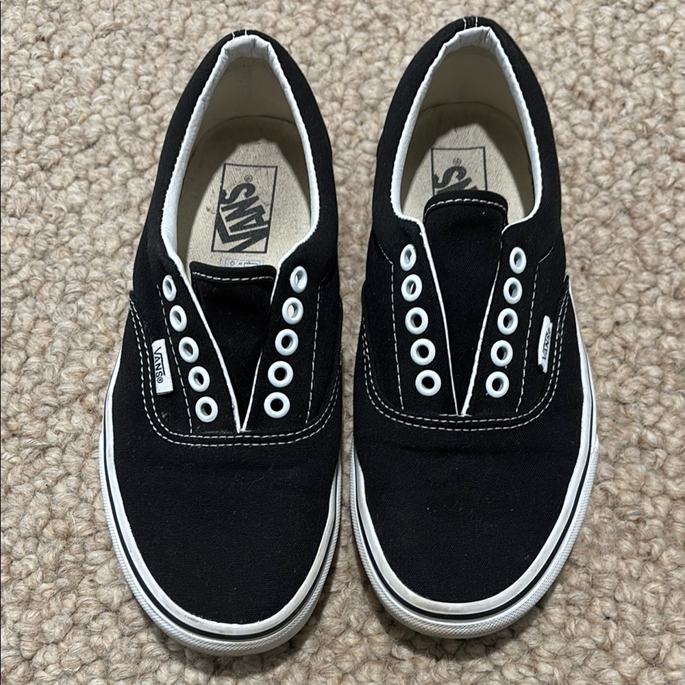 Vans Black and White Sneakers with Canvas Upper and Slip-On Design
